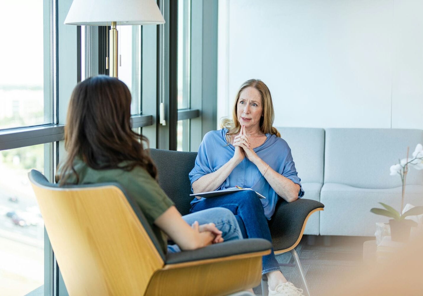 Medical professional conducting an independent assessment consultation with a client