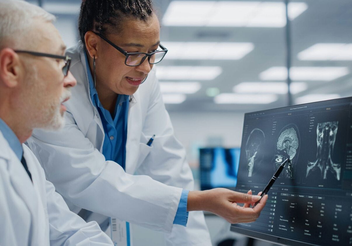 Medical specialists reviewing diagnostic imaging as part of a medical-legal assessment